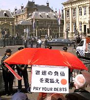 Emperor, empress booed by demonstrators in The Hague